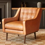 A leather recliner chair with tufted buttons.