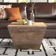Square-shaped coffee table with a modern design and elegant copper detailing