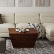 Square-shaped coffee table with a modern design and elegant copper detailing