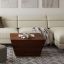 Square-shaped coffee table with a modern design and elegant copper detailing