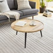 Modern round coffee table with a natural wood top