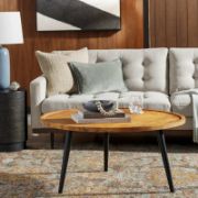 Modern round coffee table with a natural wood top