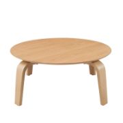 Round coffee table with curved, angled legs reflecting a modern design